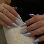 Close-up of hands with light blue nail polish on a neutral background