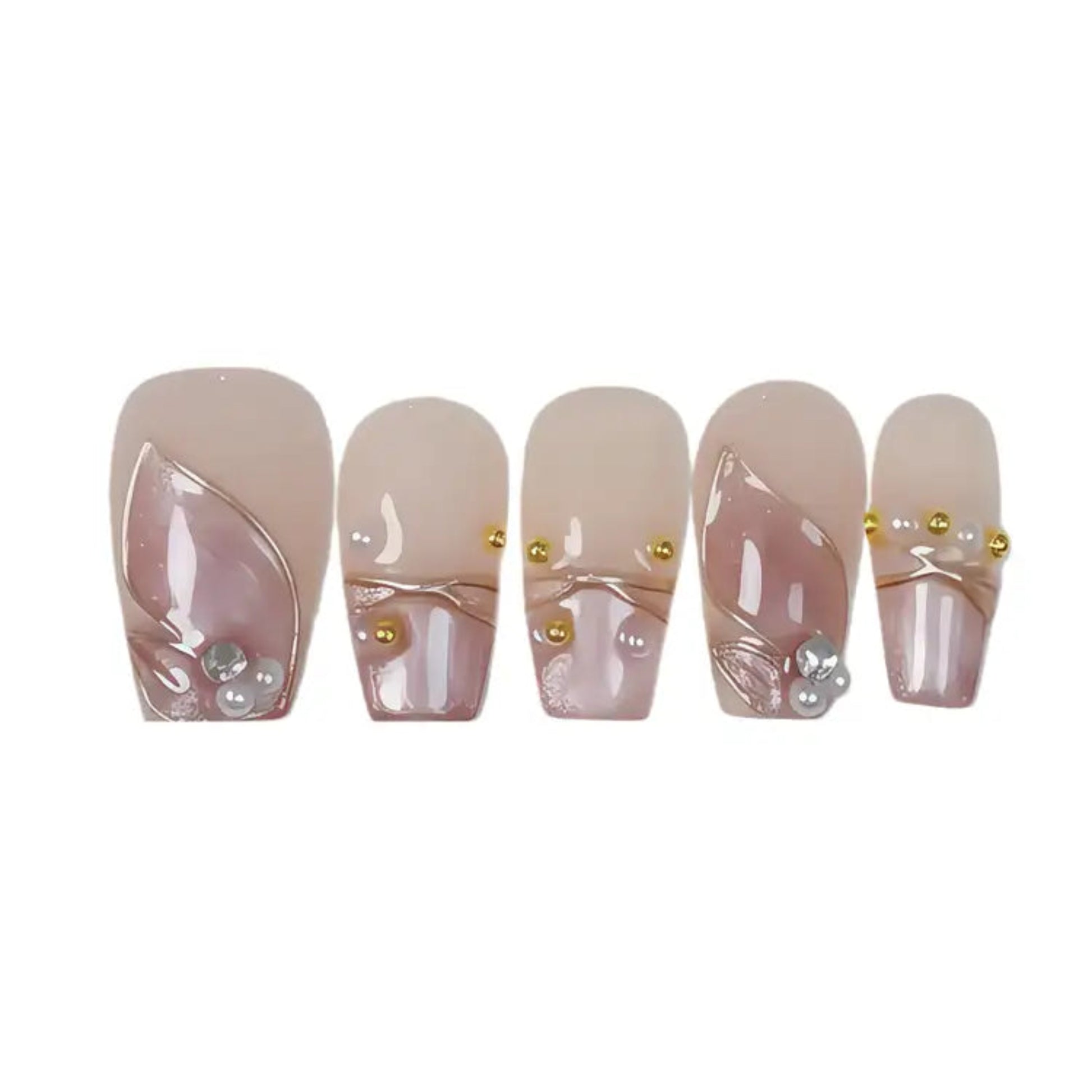 Set of five decorative false nails with gold accents and pearls on a white background