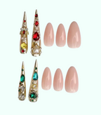 Decorative nail tips with gemstones and plain pink nails on a white background