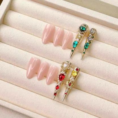 Decorative false nails with gemstones on a beige surface