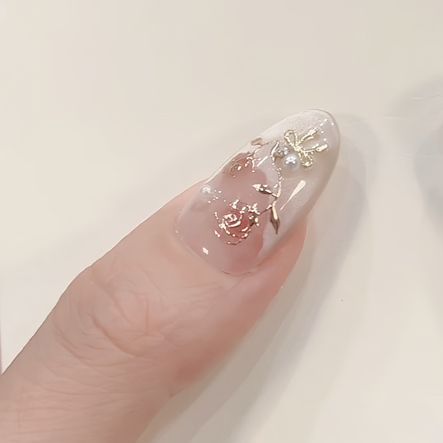 Nail with floral design on a light background