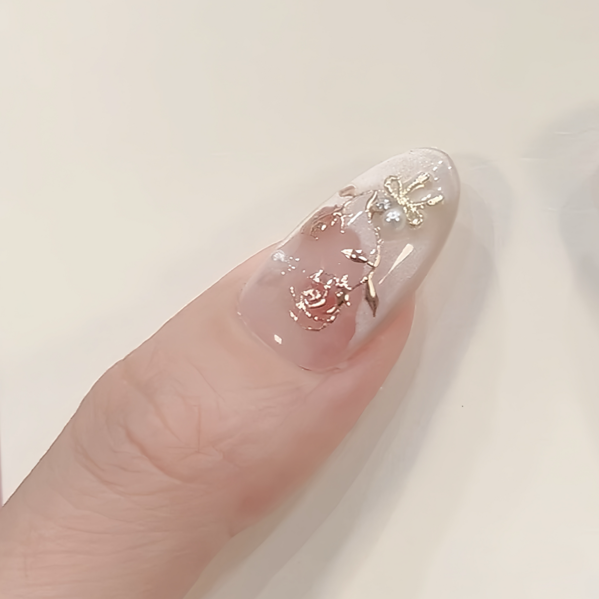 Nail with floral design on a light background
