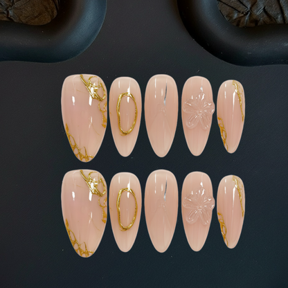 Set of pink nail art designs with gold accents on a dark background