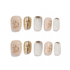 Set of nail designs with gold and beige patterns on a white background