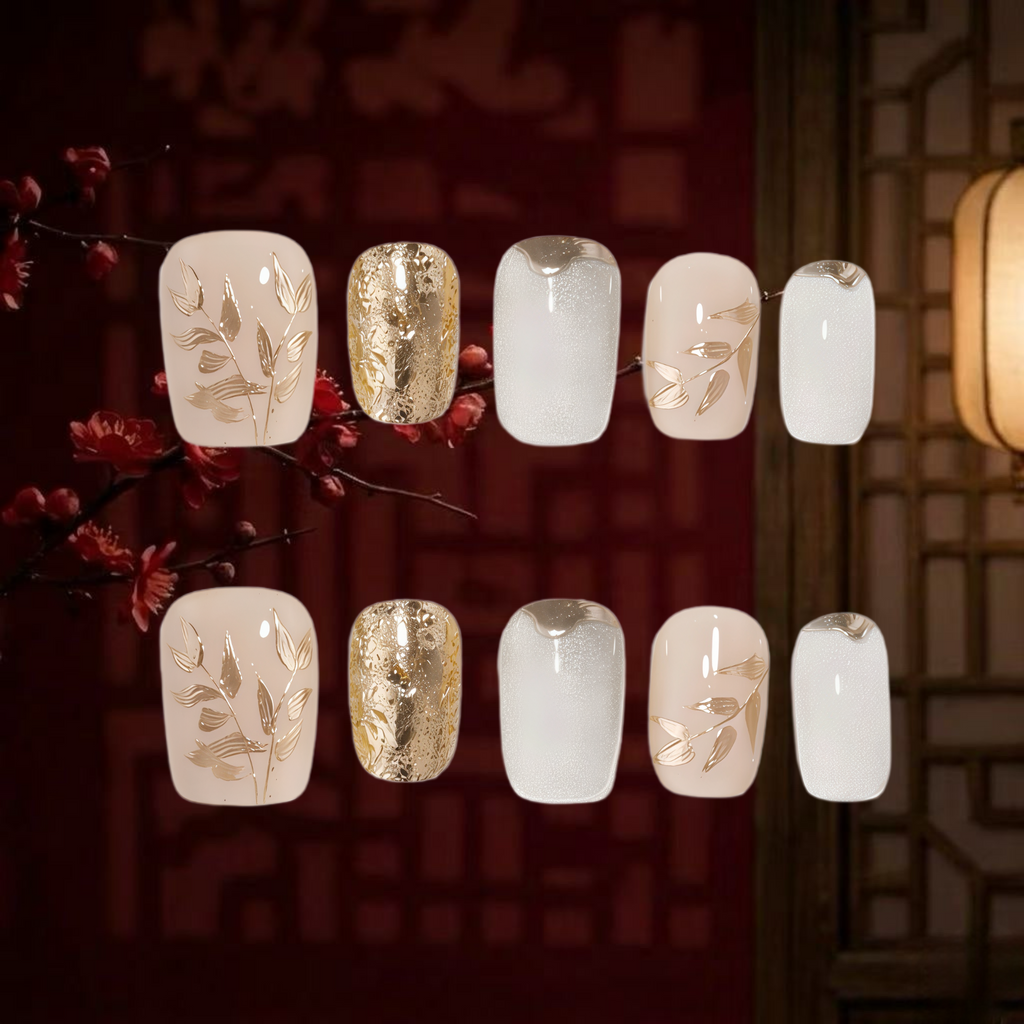 Set of nail art designs with gold and white patterns on a dark background