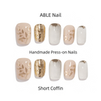 Collection of ABLE Nail handmade press-on nails with various designs on a white background.