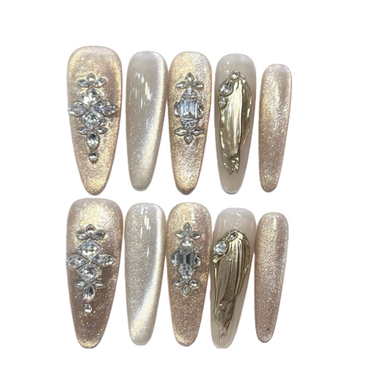 Set of decorative nails with gemstones on a white background