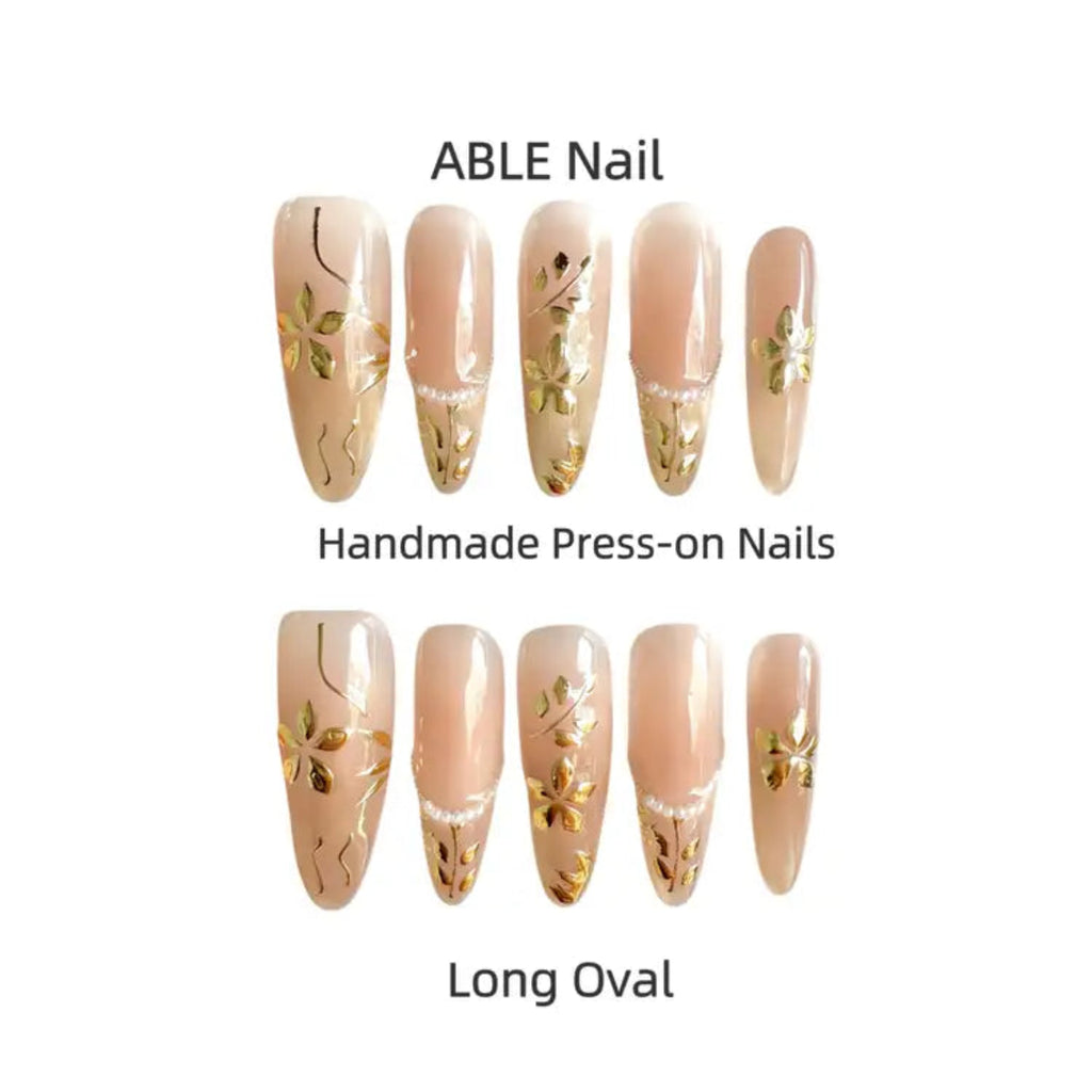 Handmade press-on nails with floral design on a white background, labeled 'ABLE Nail'.
