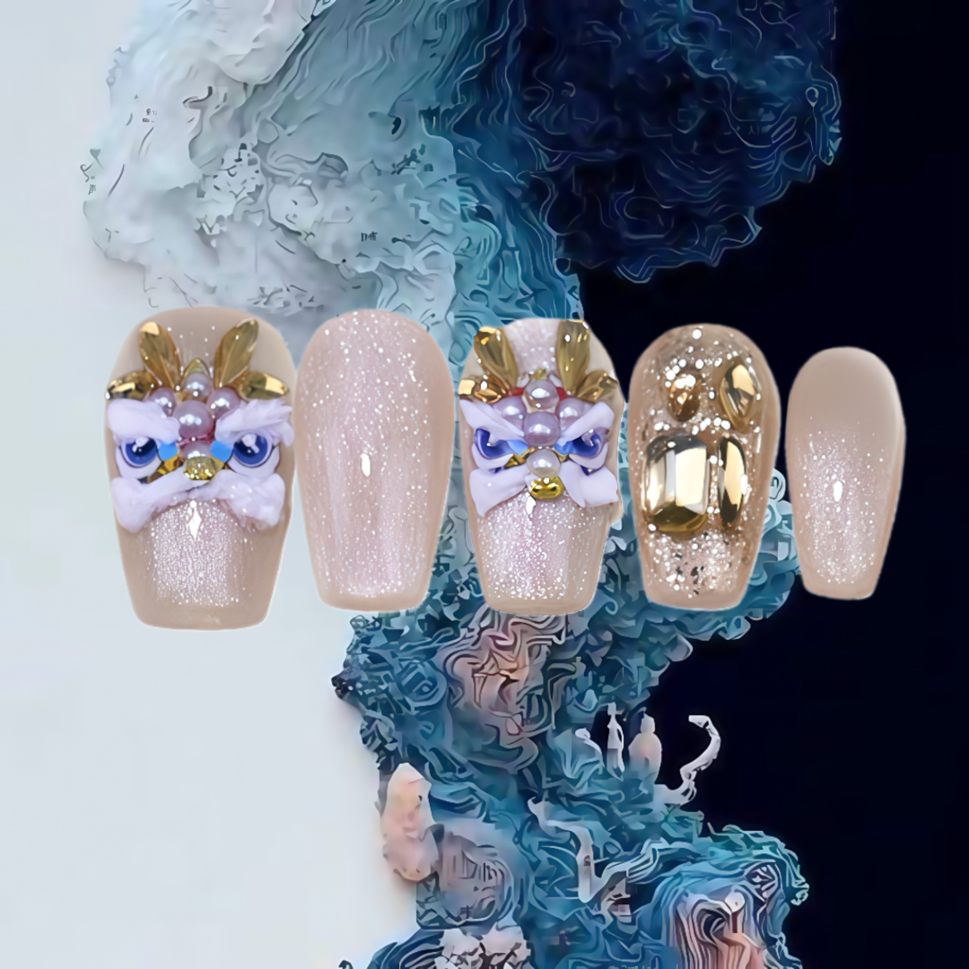 Decorative nails with gold and white designs on a textured blue and white background