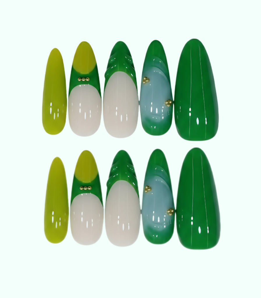 Set of green, white, and yellow nail art designs on a white background