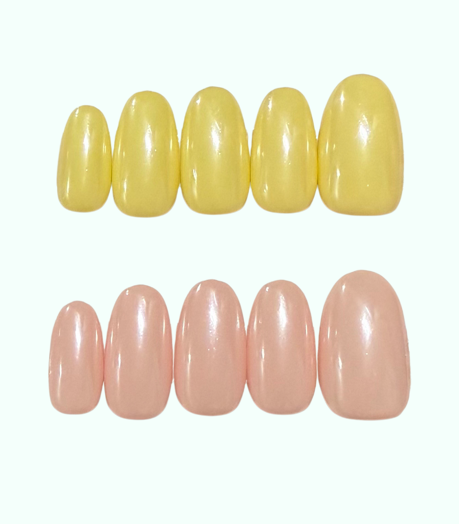 Two sets of glossy artificial nail tips displayed on a plain white background. The top set is a pale yellow shade, and the bottom set is a soft peachy pink shade.