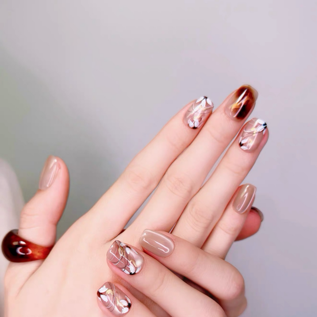 Hand with stylish nail art on a plain background