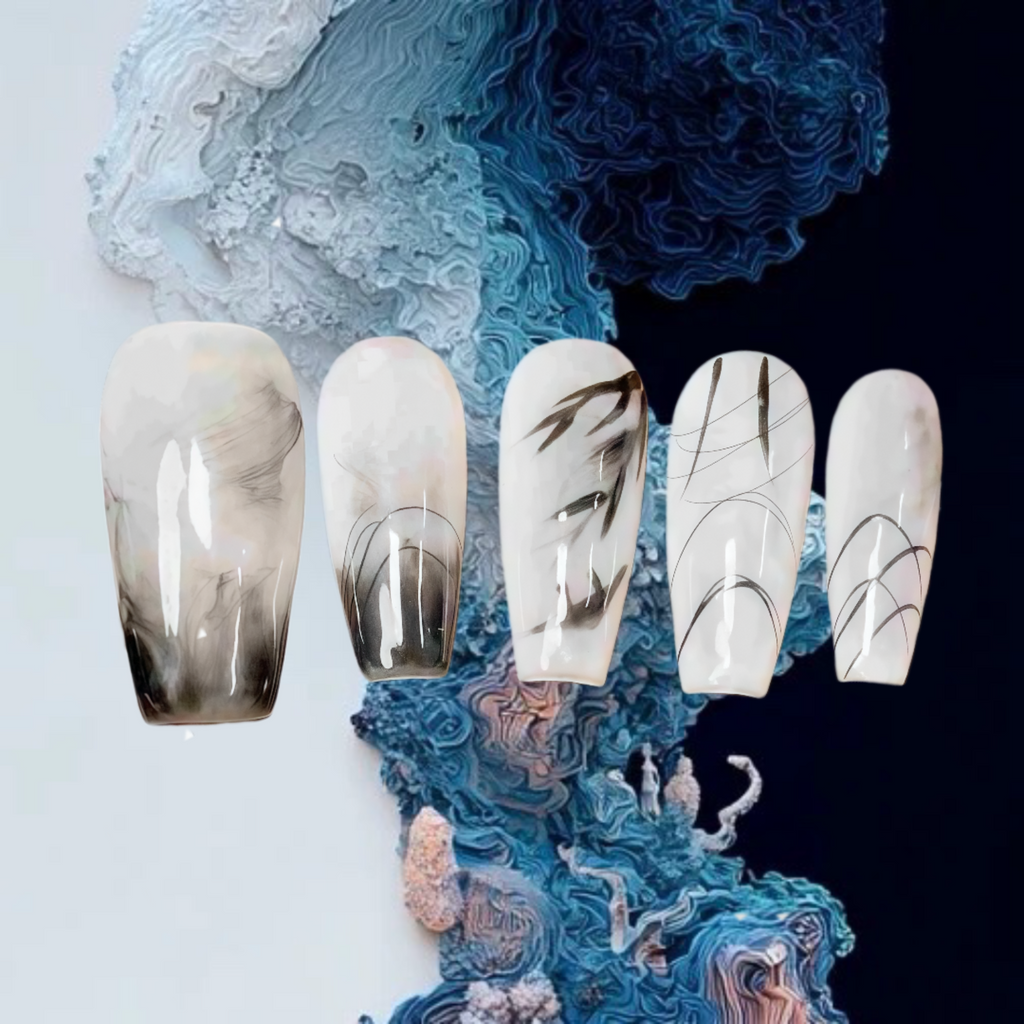 Set of five decorative nails with a marble design on a textured blue and white background