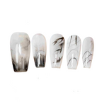 Set of five nail art tips with marble design on a white background