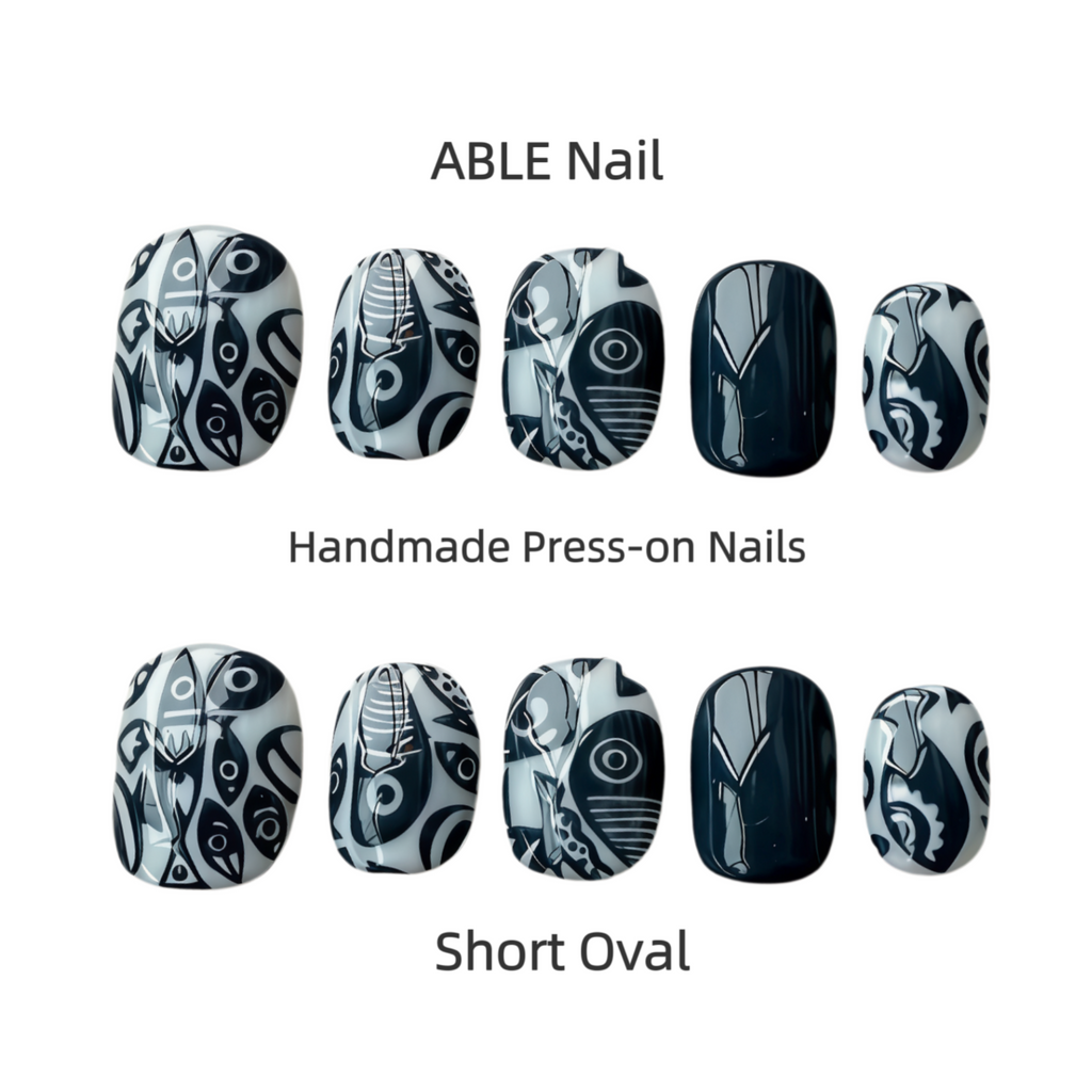 Handmade press-on nails with black and white designs on a white background, labeled 'ABLE Nail'.