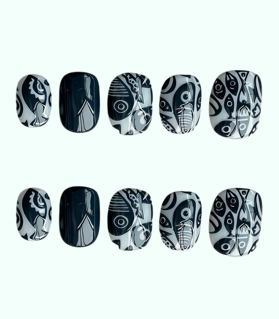 Black and white patterned nail art designs on a white background