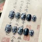 Decorative black and white stones on an ancient text background