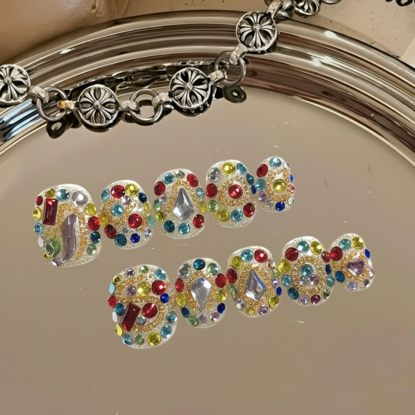 Bracelet with colorful gemstones spelling 'LOVE' on a reflective surface.