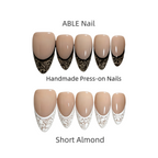 Handmade press-on nails with decorative tips on a white background, labeled 'ABLE Nail'.