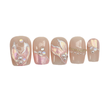 Set of five decorative nail wraps with various designs on a white background