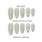 Set of ABLE Nail handmade press-on nails in medium almond shape on a white background.