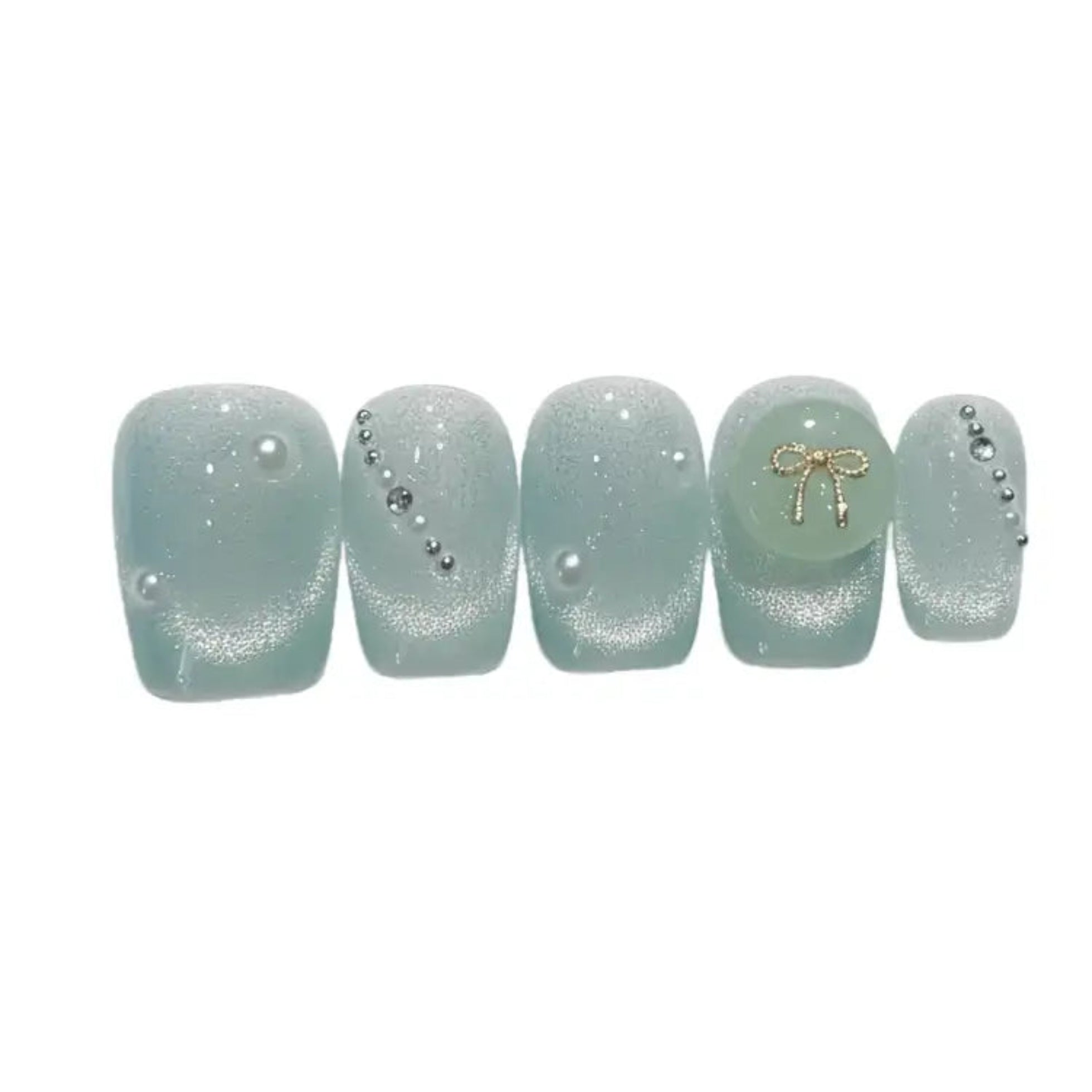 Set of light green nail wraps with decorative elements on a white background