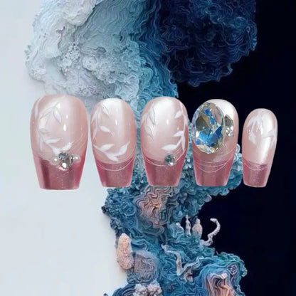 Set of decorative nails with gemstones on a textured blue and white background