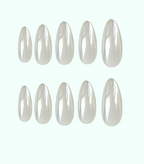 Set of white nail extensions on a white background