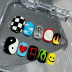 Set of colorful nail art designs in a clear case