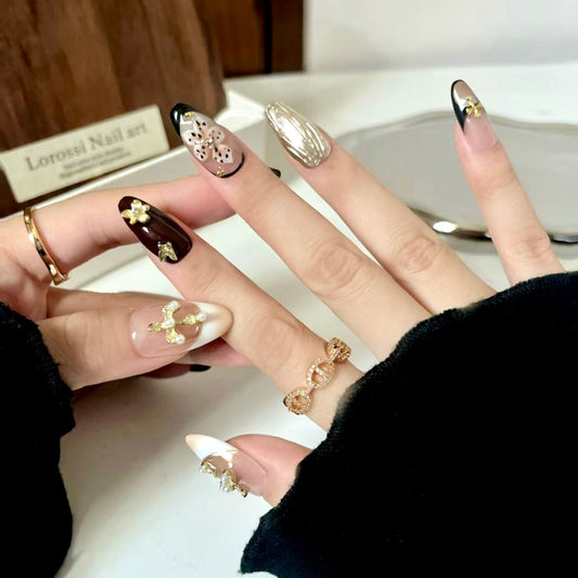 Close-up of hands with decorative nail art and a blurred background