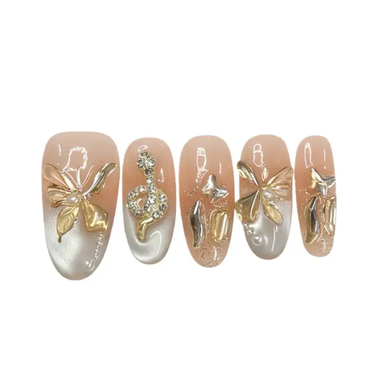 Set of five decorative nails with gold and silver designs on a white background