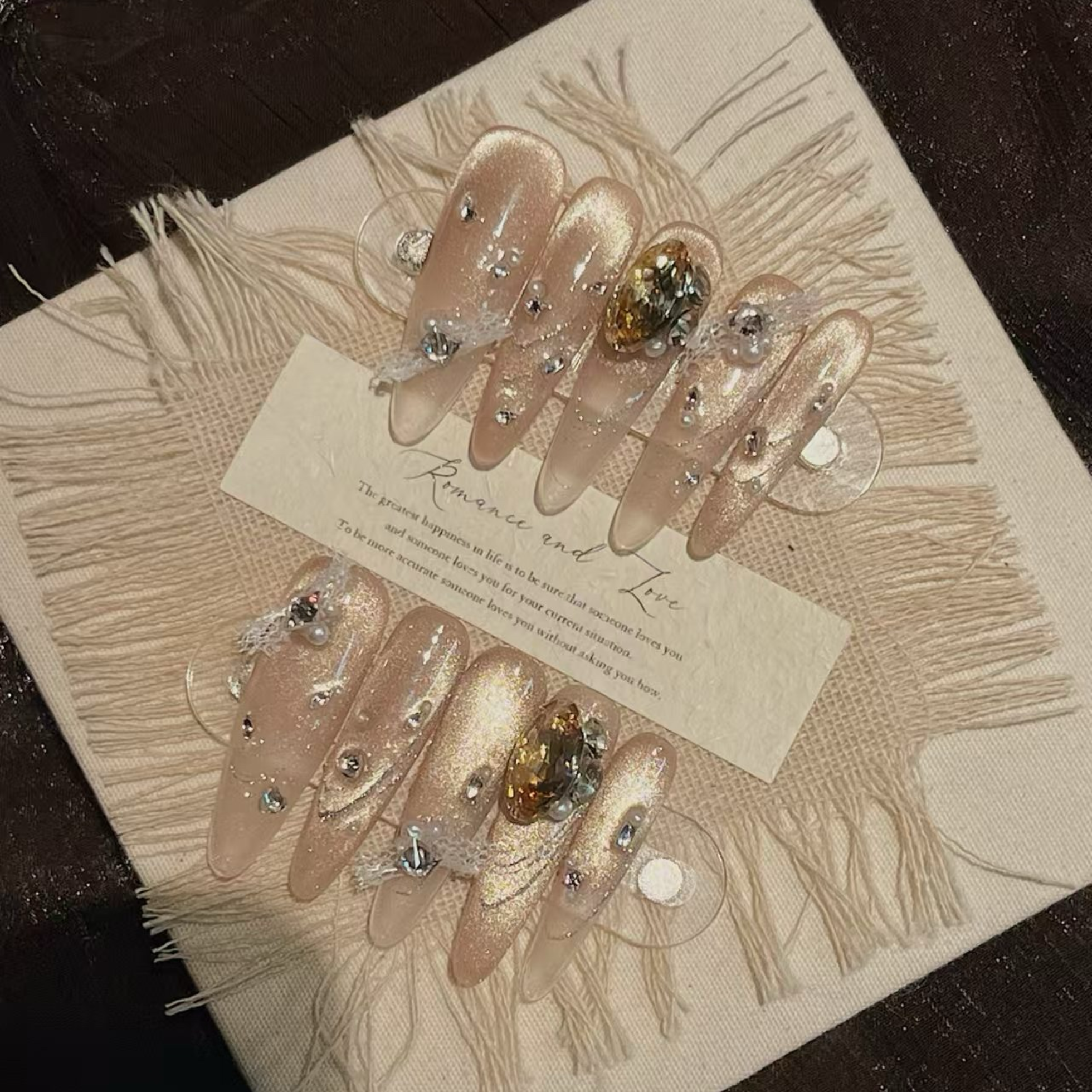 Set of decorative hair clips with gemstones on a textured surface