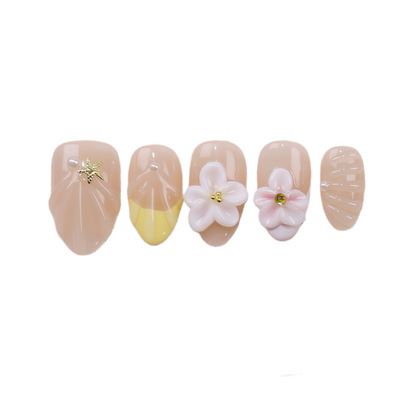 Set of five decorative nails with floral designs on a white background