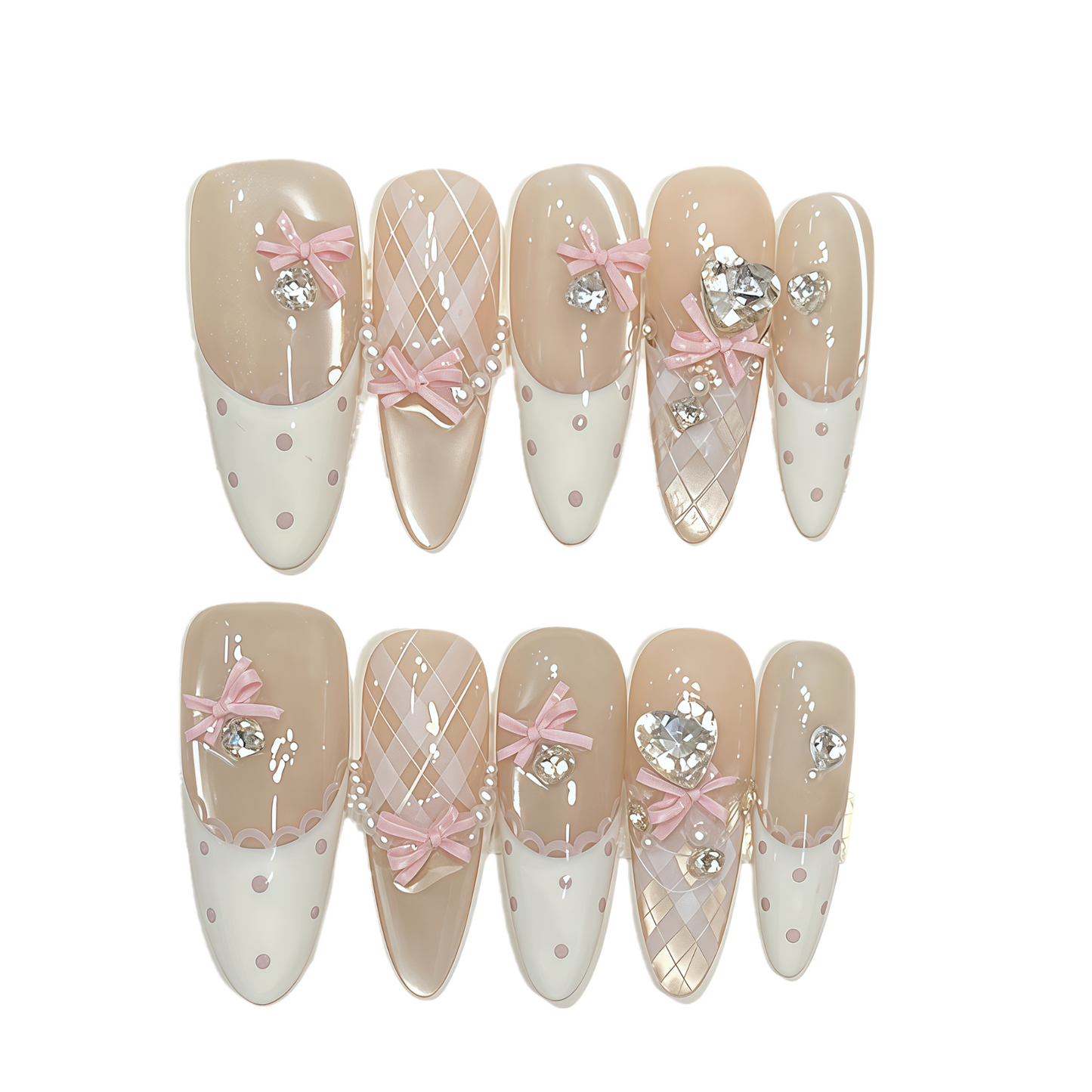 Decorative false nails with pink bows, crystals, and white polka dots on a beige and white background.