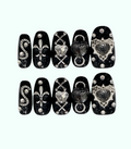 Decorative nail art stickers with various designs on a white background