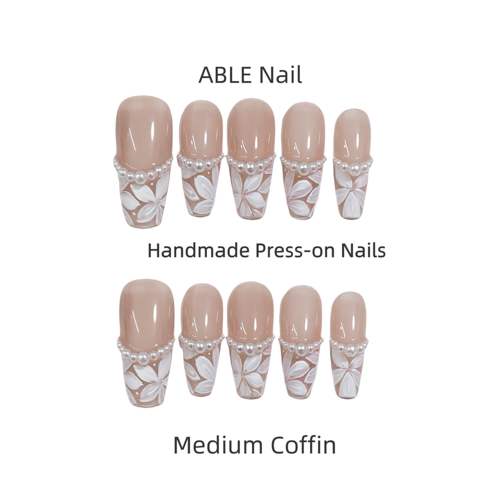 Set of ABLE Nail handmade press-on nails with decorative design on a white background
