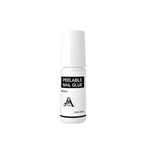 Bottle of peelable nail glue on a white background