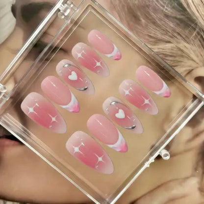 Set of pink and clear nail designs in a clear case