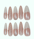 Set of pink and white nail extensions on a white background