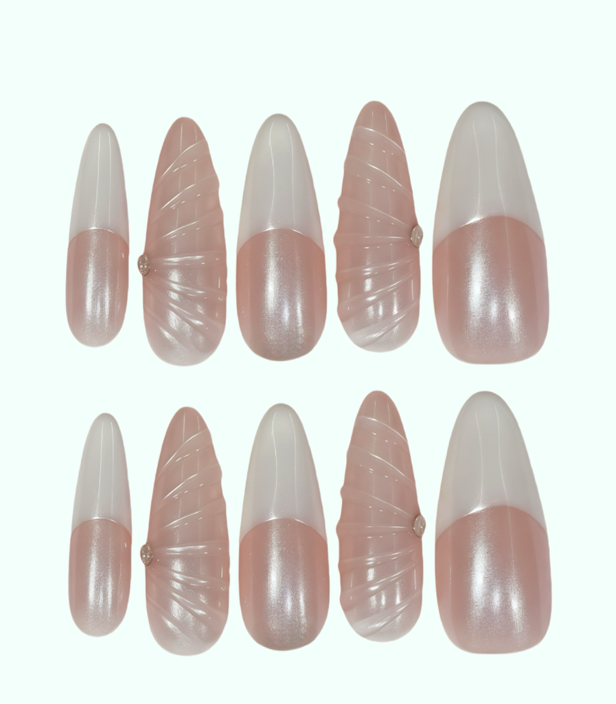 Set of pink and white nail extensions on a white background