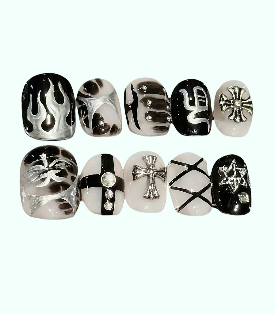 Set of black and white nail art designs on clear nail forms.
