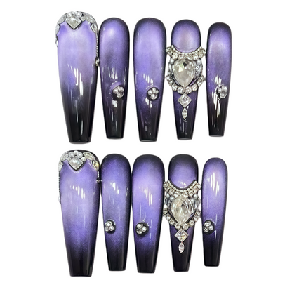 Set of purple nail extensions with decorative elements on a white background