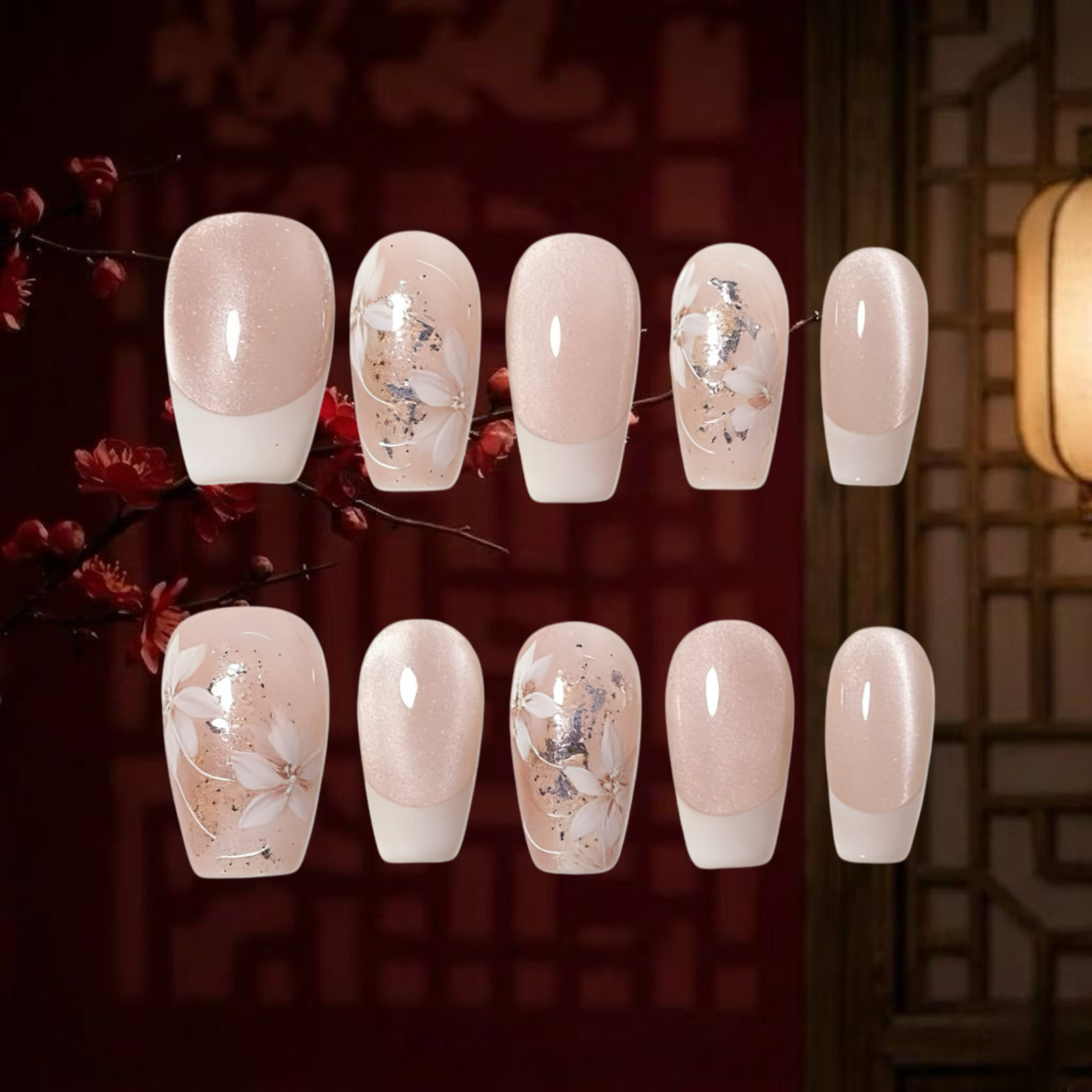 Set of decorative nails with floral designs on a dark background