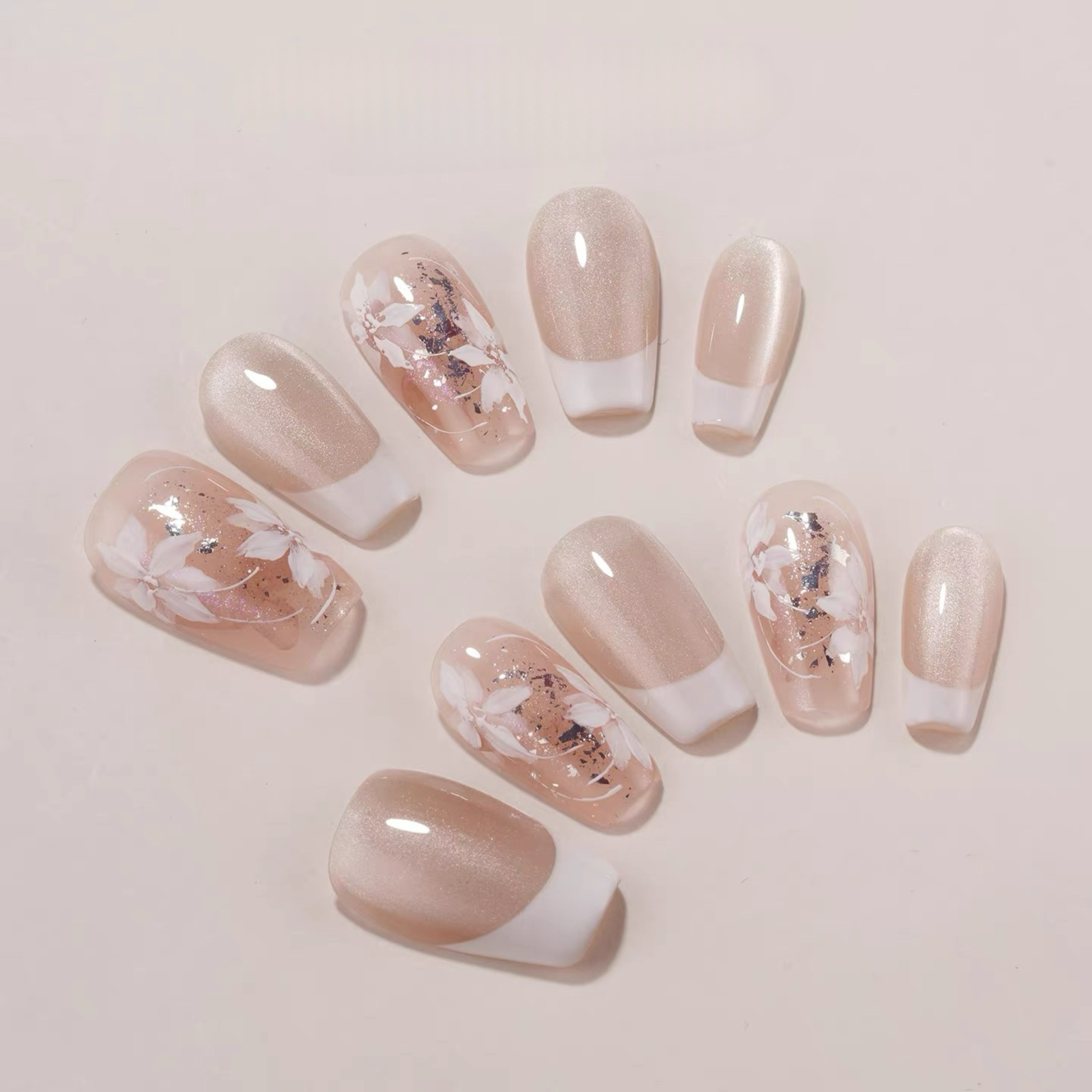 Set of nails with a gradient design on a light background