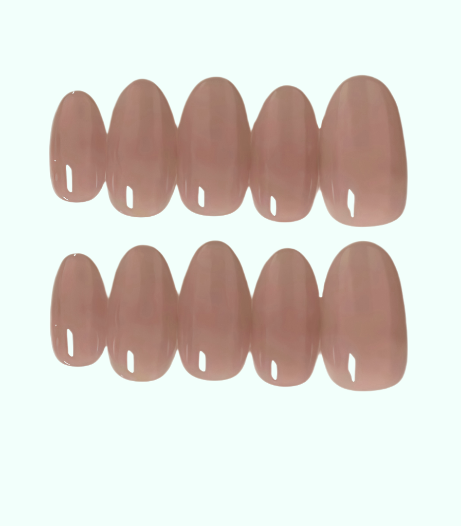 Set of nude-colored false nails on a white background