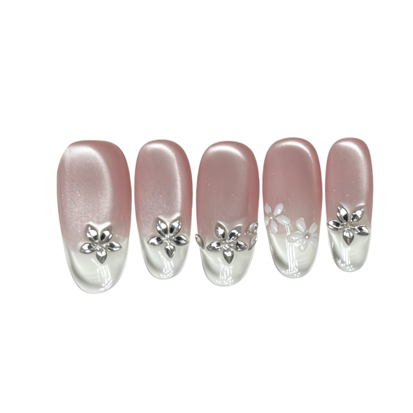 Set of five pink artificial nails with silver flower decorations on a white background