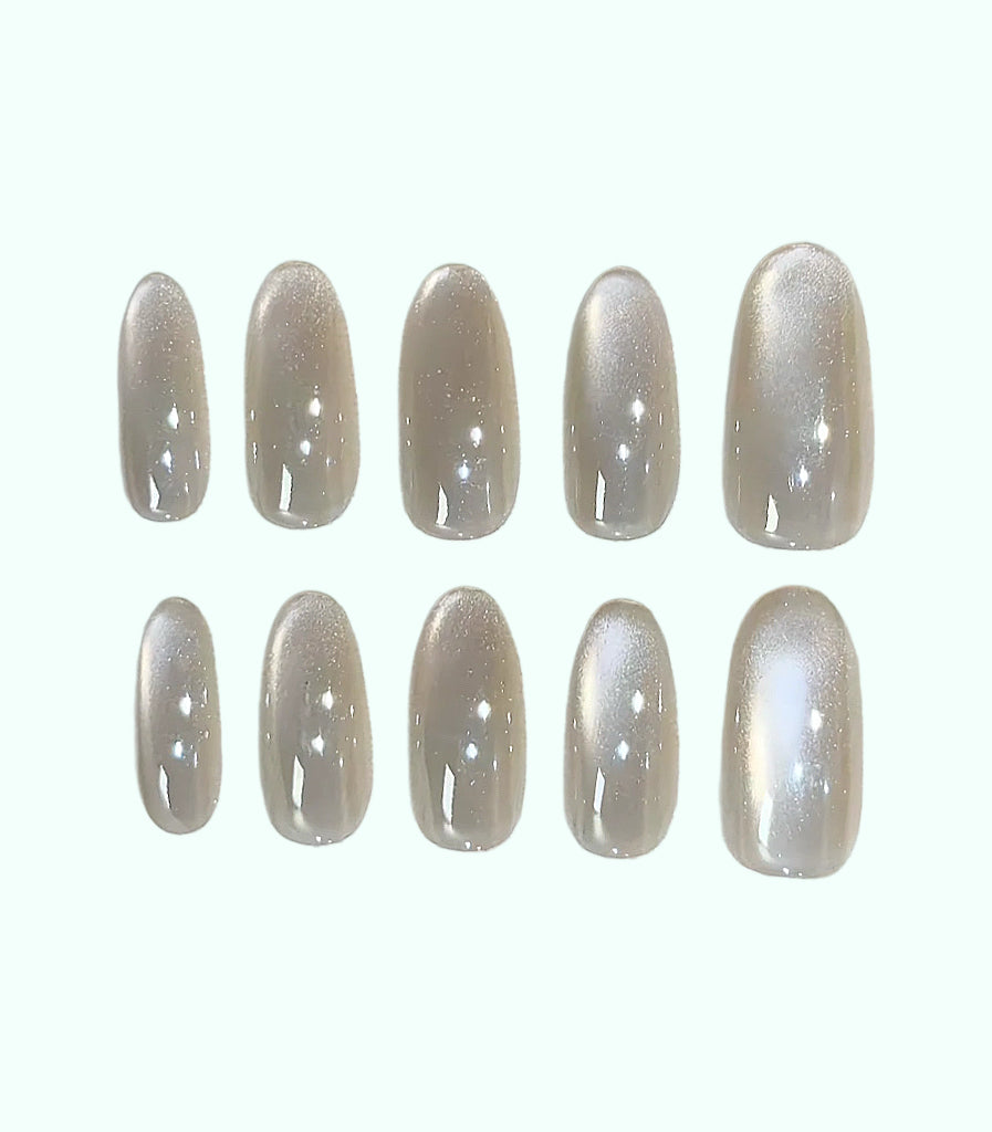 Set of beige nail polish strips on a white background