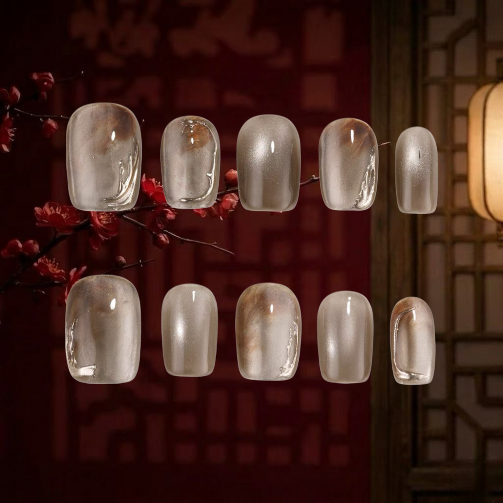 Set of clear nail polish samples on a dark background with cherry blossoms.