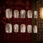 Set of clear nail polish samples on a dark background with cherry blossoms.