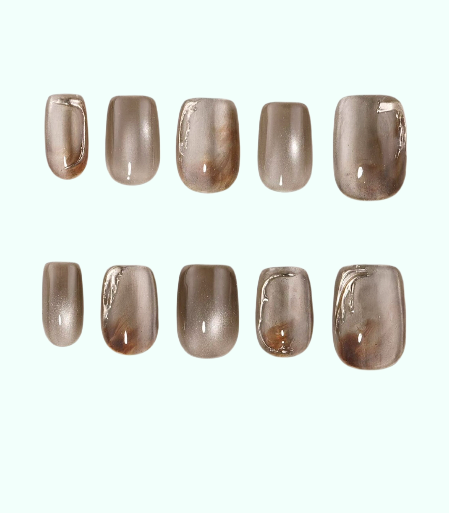Row of brown nail polish samples on a white background